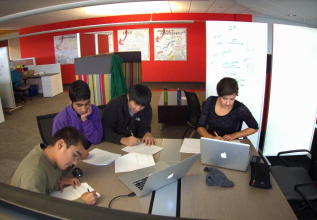 Students working with ProQuest products on a school research project